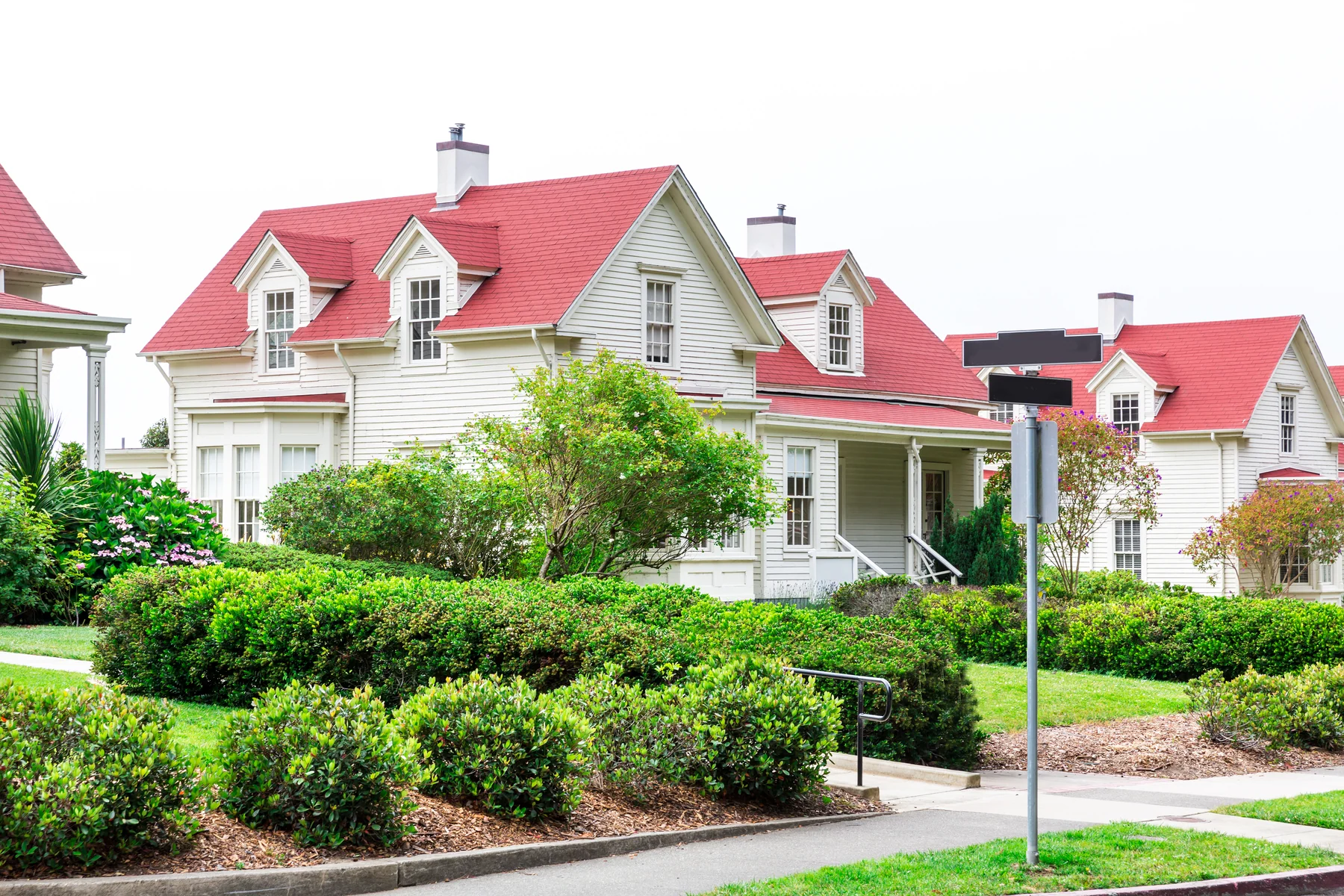 White home on a sloping lawn representing West Columbia